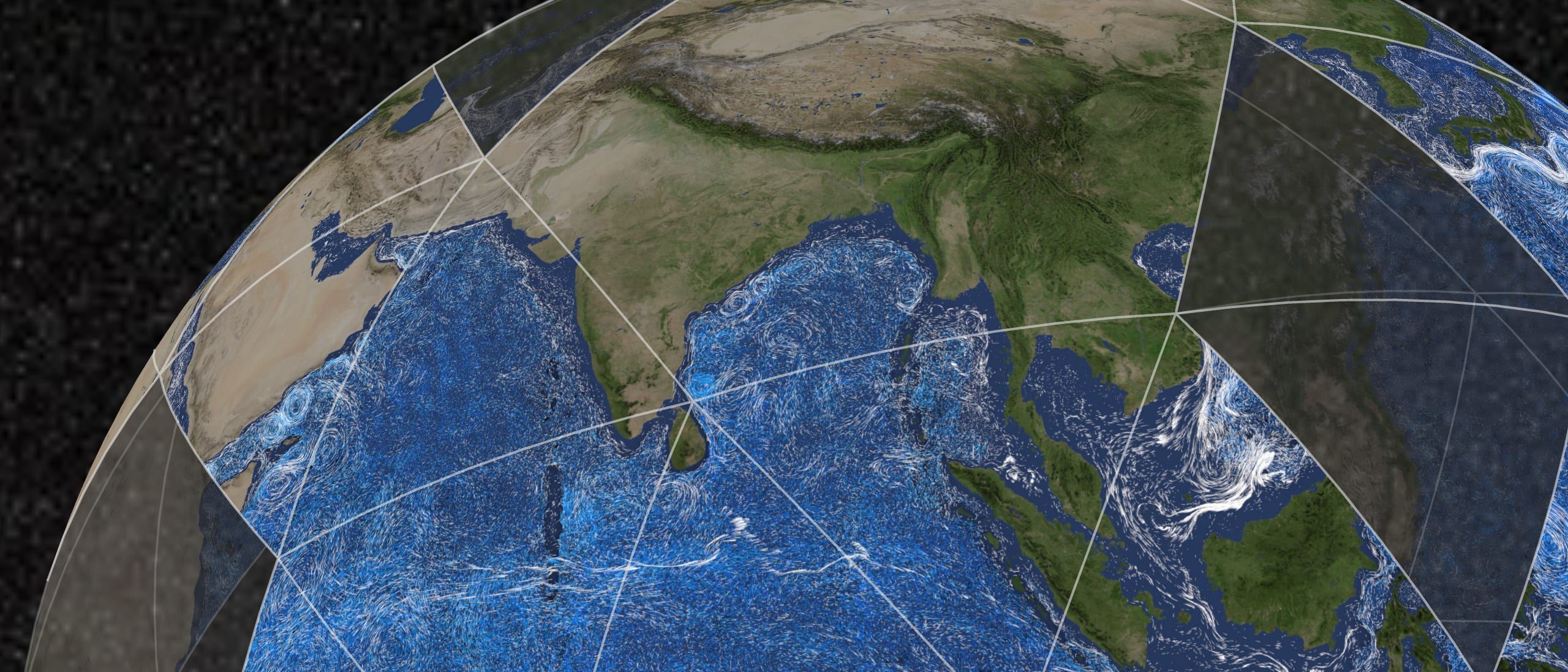 The Indian Ocean's currents swirling in white around India and South-East Asia, on a globe of pieces rising from the foot of the picture.