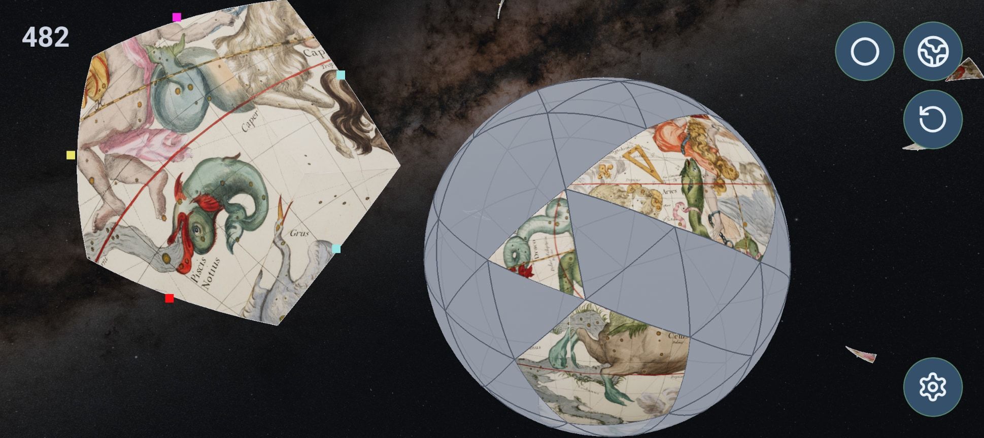 A star atlas in pieces, two placed on a grey sphere and one held up showing Capricorn as a sea-goat, with the score at 482.